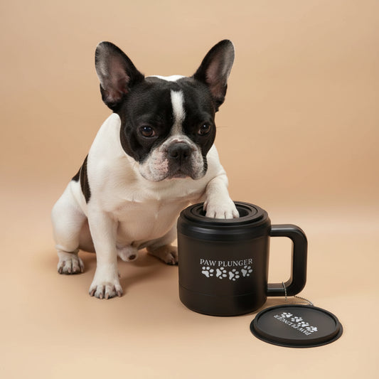 Black mug with 'Paw Plunger' branding on a beige background
