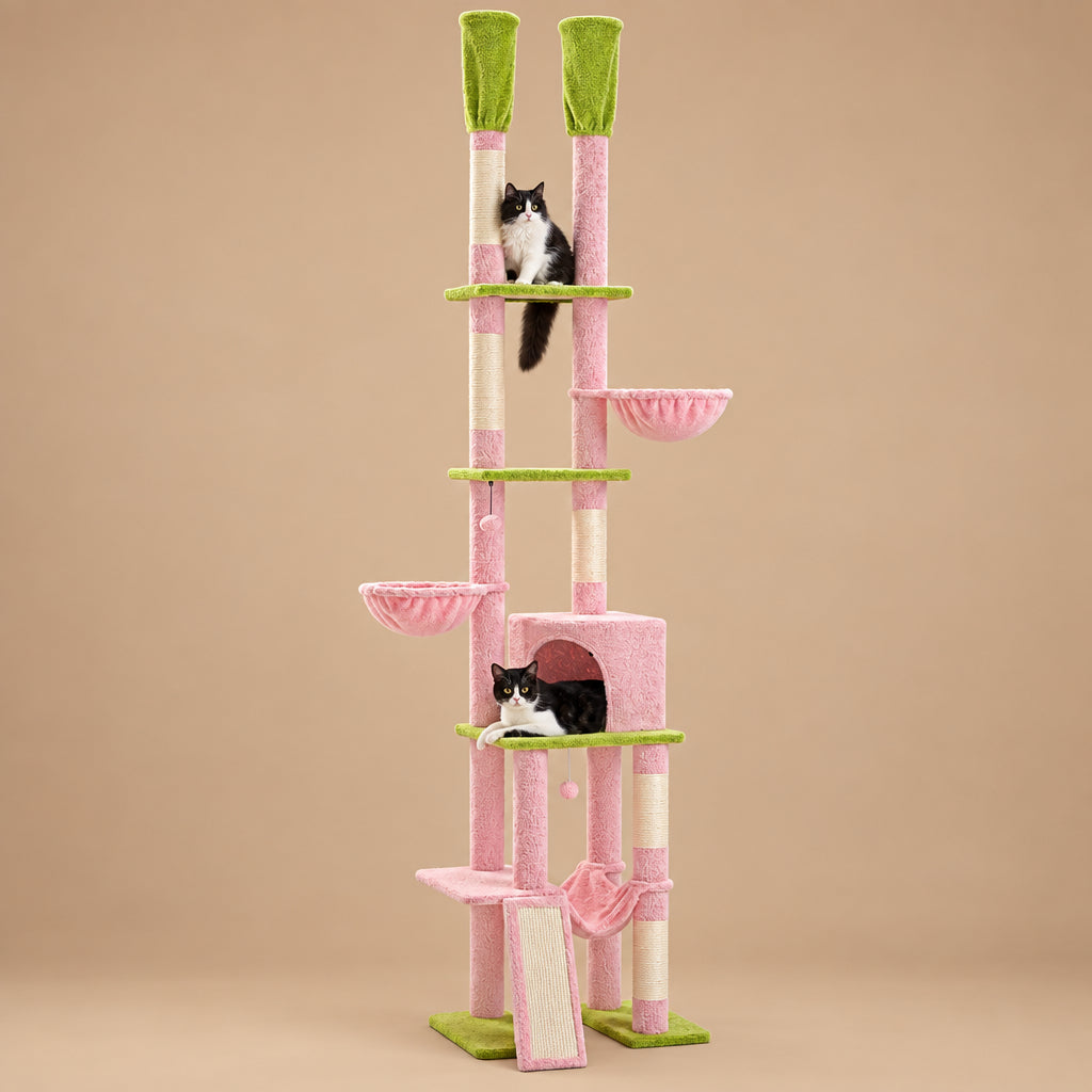 Pink and green cat tree with multiple levels and a cat sitting on it.