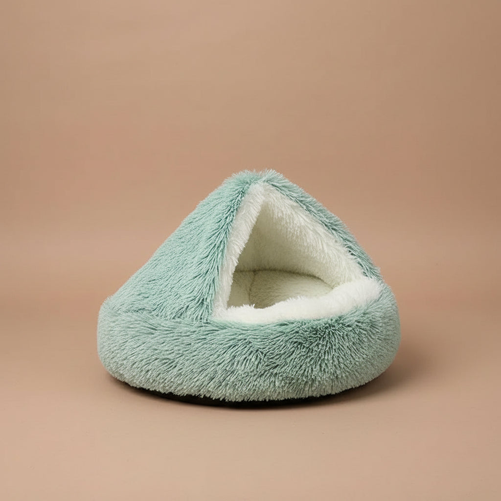 Plush green pet bed with white interior on a white background