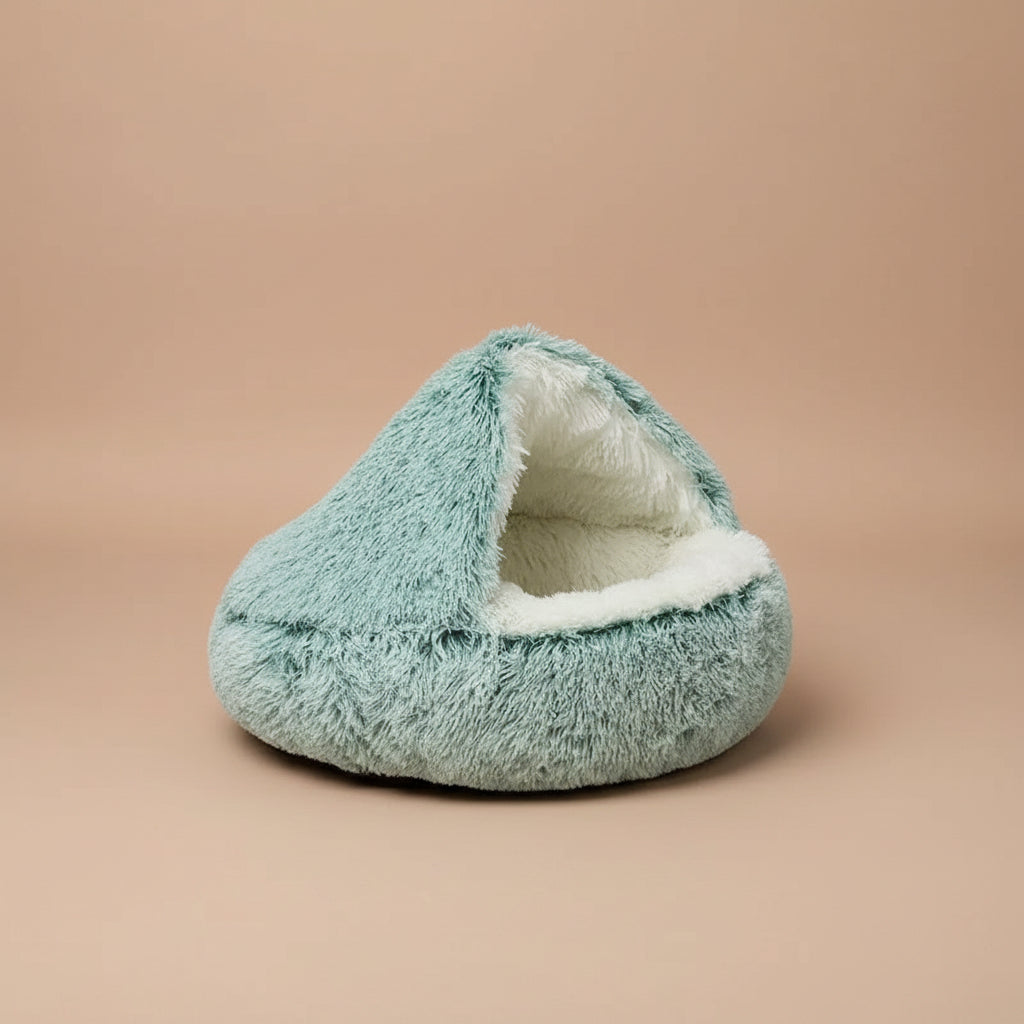 Plush green pet bed with plush white interior on a white background