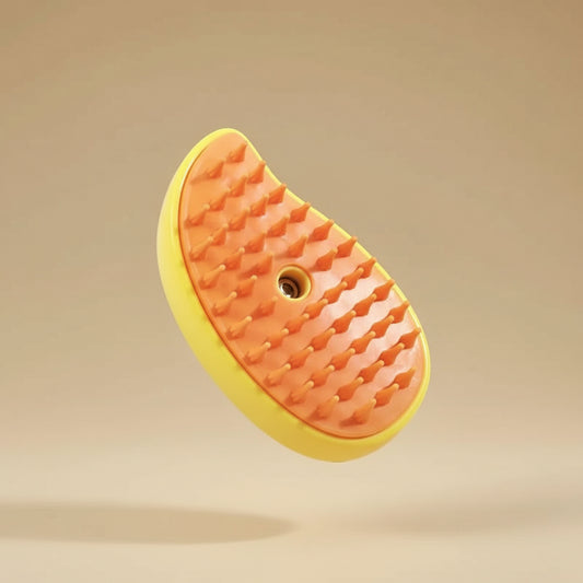 Pet grooming brush with orange bristles on a yellow background
