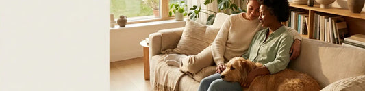image of a couple relaxing on a sofa with their dog