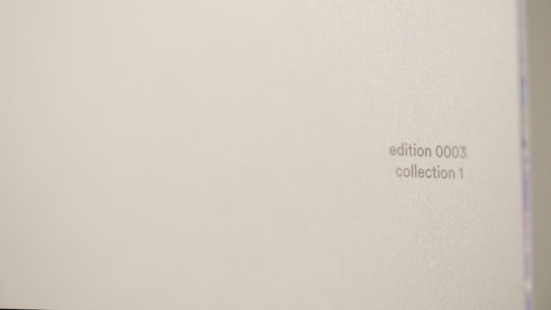 a close up of a white wall with the word collection on it