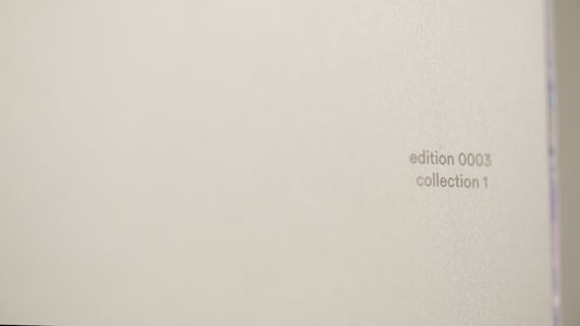 a close up of a white wall with the word collection on it