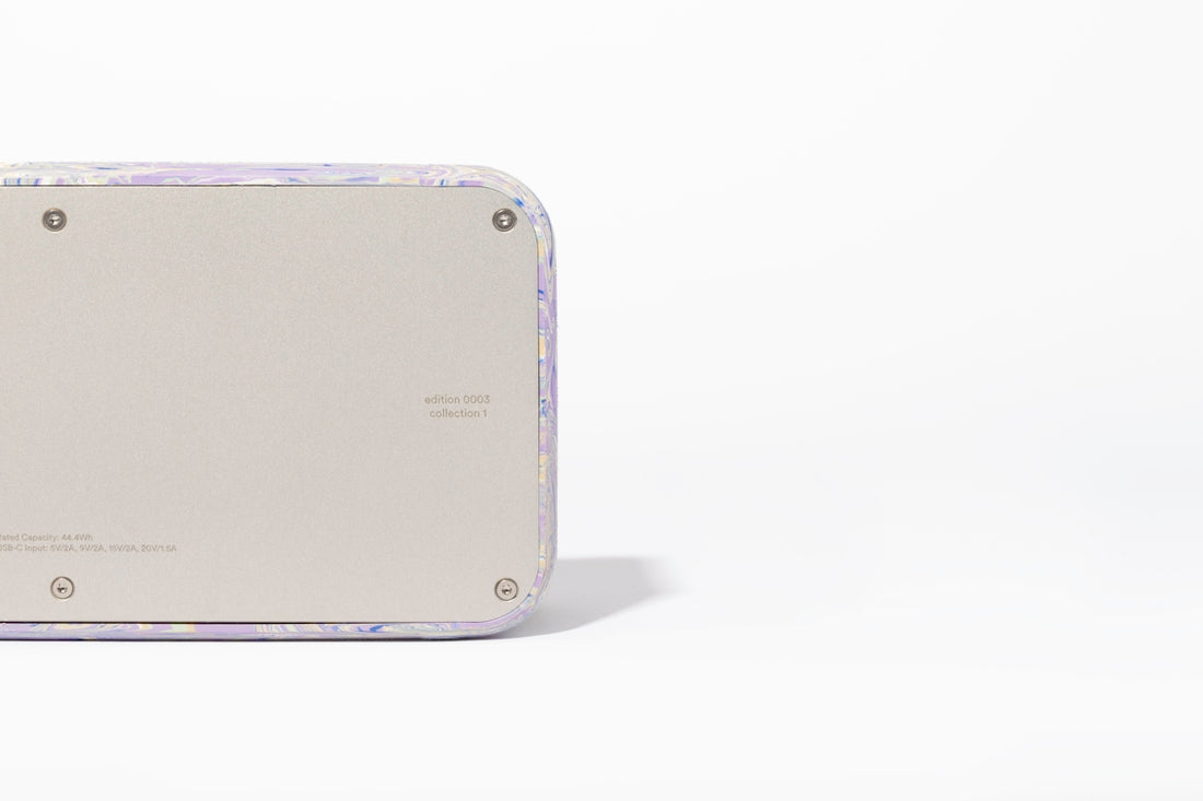 a close up of a cell phone on a white surface