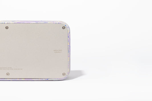 a close up of a cell phone on a white surface