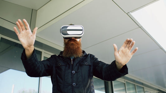 Man with beard wearing virtual reality headset outdoors