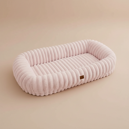pink human size pet bed on a beige background.