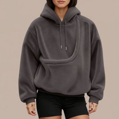 Person wearing a gray hoodie on a white background