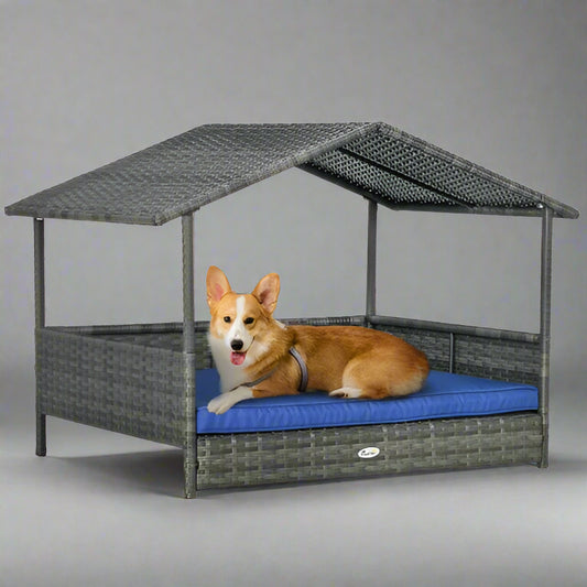 Dog lying on a blue cushion in a gray pet house with a white background