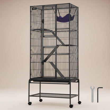 Large black metal pet cage on wheels with 4 platforms, 3 ramps and a hammock on a beige background