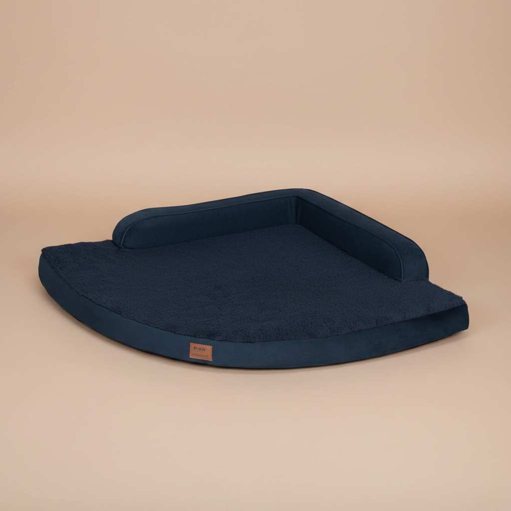 dark blue pet bed in a room with white walls and wooden flooring.