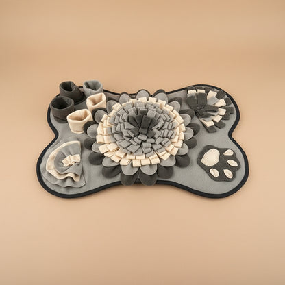 Gray bone-shaped pet toy with different designs and paw prints on a beige background
