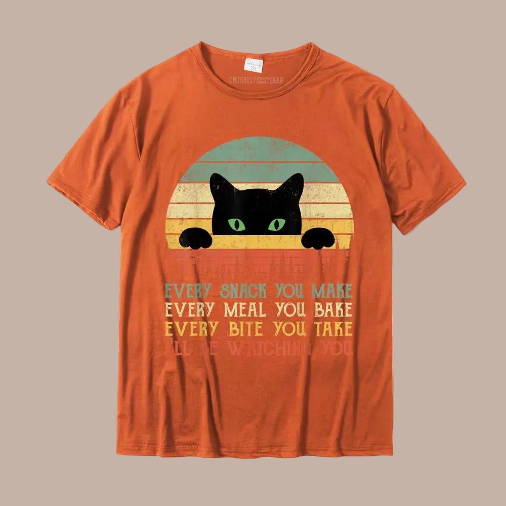 Orange t-shirt with a black cat graphic and text on a white background