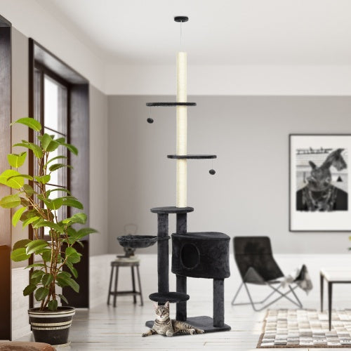 Cat tree in a modern living room with a cat sitting on it