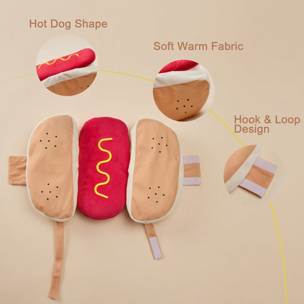 A plush hot dog toy or cushion set shown on a white background with callout circles and text reading 'Hot Dog Shape,' 'Cotton Fabric,' and 'Hook & Loop Design.' The main product consists of two tan bun halves with small black dot details and a bright red center filled with a yellow wavy line, plus small hook-and-loop tabs extending from the sides.
