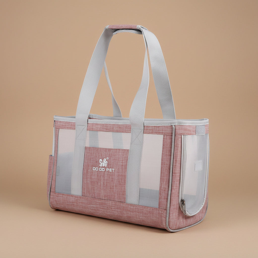 Pink pet carrier with mesh sides on a beige background