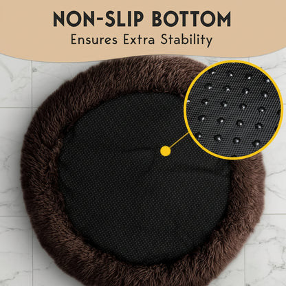 Round black cushion with brown fuzzy rim on a marble surface, highlighting non-slip bottom.