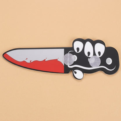 Cartoon knife with velcro on a tan background