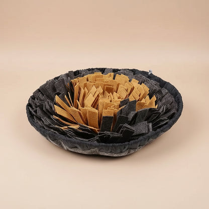 Black and gray woven bowl with gold on the inside on a white background