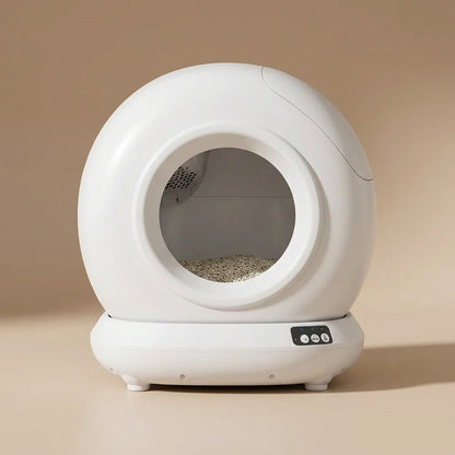White self-cleaning cat litter box with a beige background