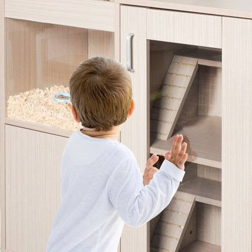 Child observing a pet through an observation window in a pet cabinet 