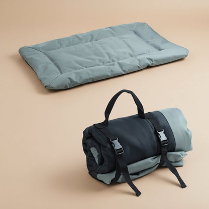 Gray/Green sleeping pad and rolled-up sleeping bag on a white background