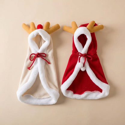 Two plush Santa Claus reindeer-themed pouches or hats laid flat on a white background. One is cream with white trim and a red drawstring, and the other is red with white trim and a red drawstring.