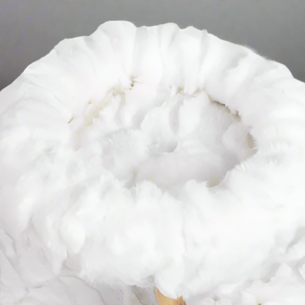 Close-up of a fluffy white fabric texture on a white background