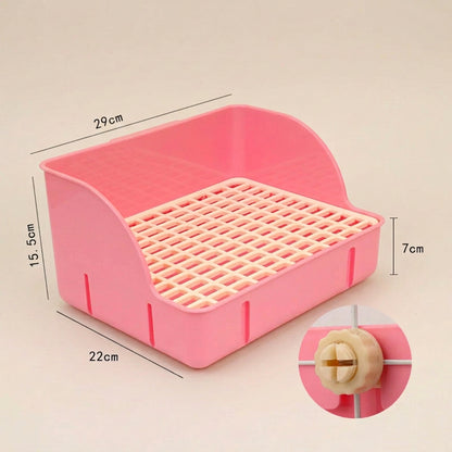 Pink plastic litter pan for rabbits & other small pets with measurements on a beige background