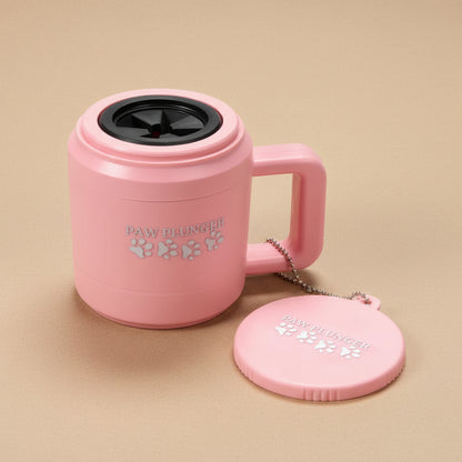 Pink mug with paw prints and 'Paw Plunger' text on a beige background