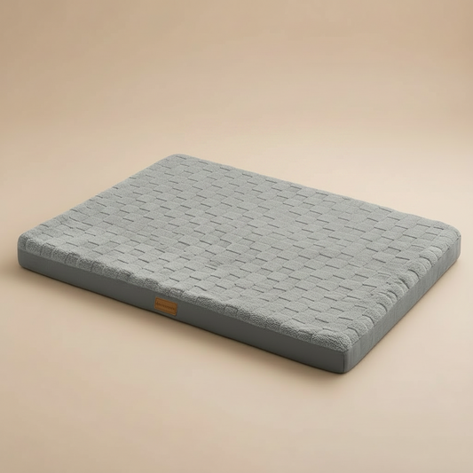 Gray orthopedic pet bed on a beige background.