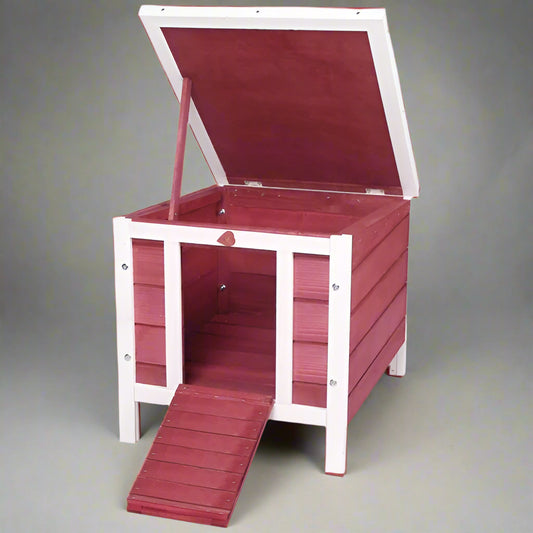 Red wooden pet house with a white frame on a white background