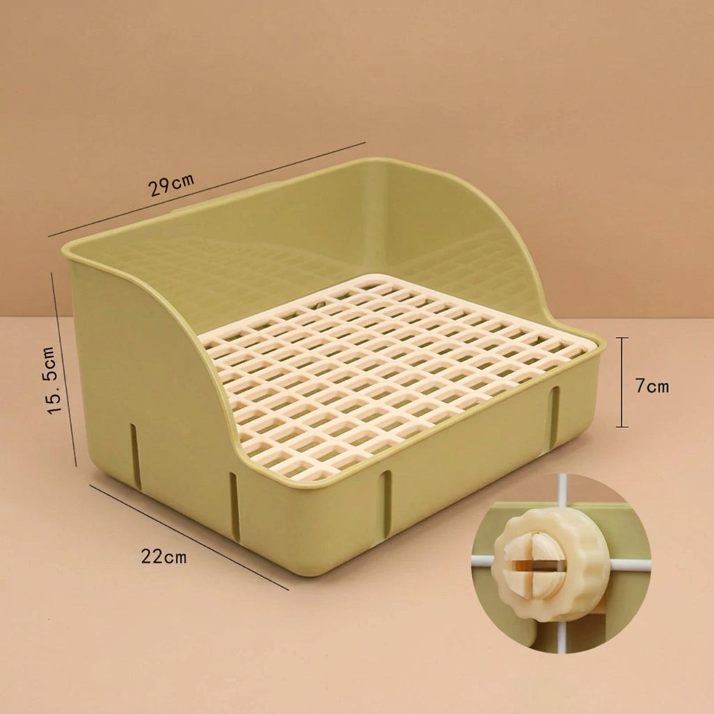 Green small pet litter box with measurements on a beige background