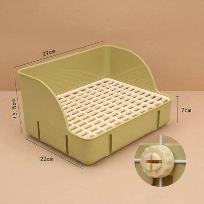 Green small pet litter box with measurements on a beige background