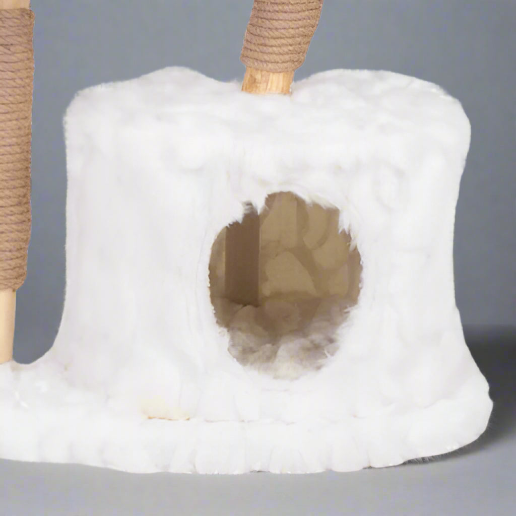 White cat tree with a hole and wooden perch on a white background