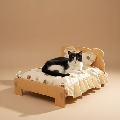 Cat lying on a small wooden bed with teddy bear design