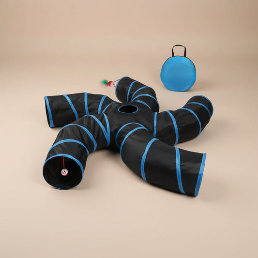 Black and blue cat tunnel with a ball and toys on a beige background
