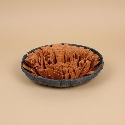 Pet bed with brown fabric and gray border on a white background