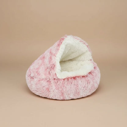 Pink plush pet bed with white interior on a white background