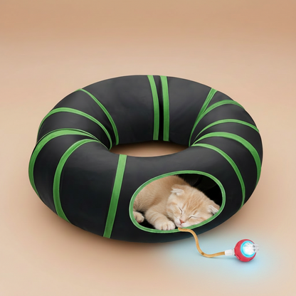Black and green inflatable tube toy with a cat and ball toy on a beige background