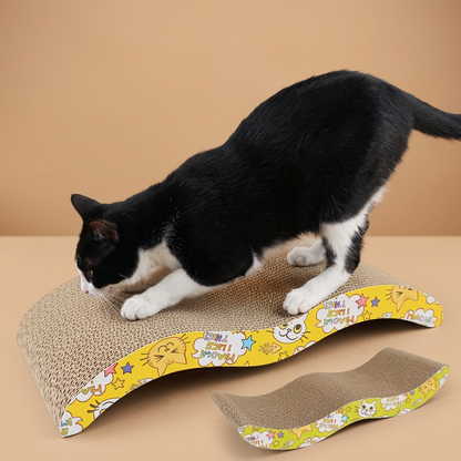 Cat playing with a corrugated cat scratcher with colorful design on a white background