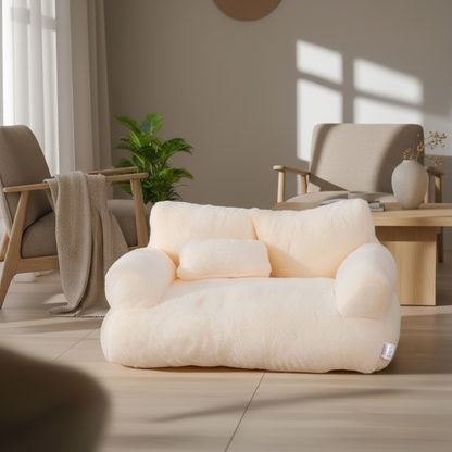 White pet sofa on a carpeted floor with a lamp and decorative items in the background