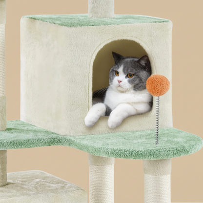 Cat sitting on a beige and green cat tree with a small orange ball attached.