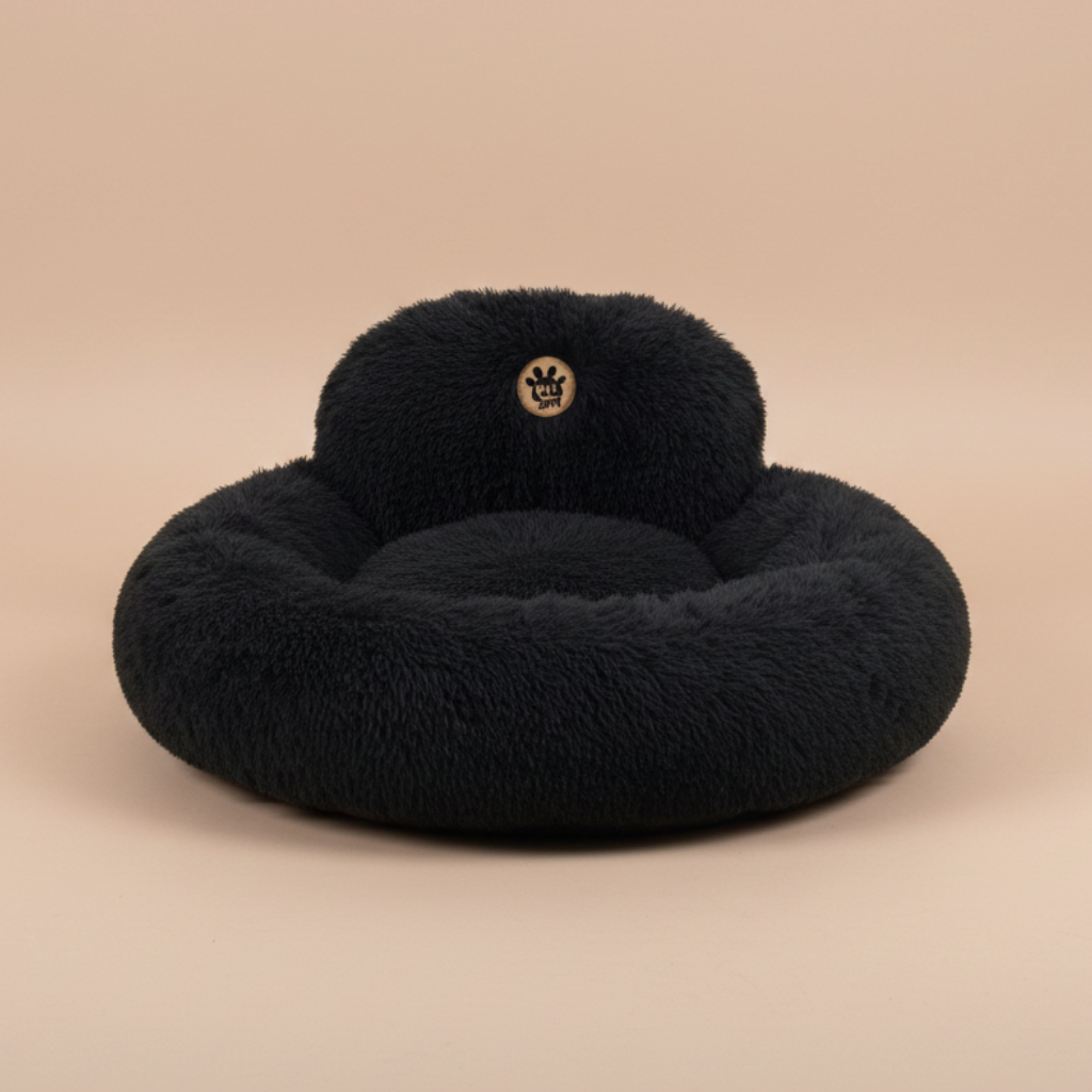 black fluffy donut bed with a visible brand logo.