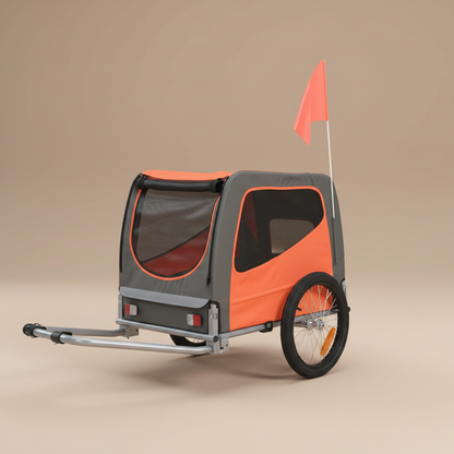 Orange and gray pet bike trailer with a red flag on a beige background