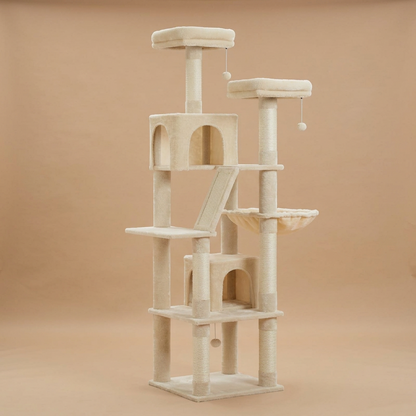 A tall multi-level cat tree with sisal-wrapped posts, platforms, a small enclosed cubby, a ramp, and hanging toy balls, photographed against a plain warm beige studio background.