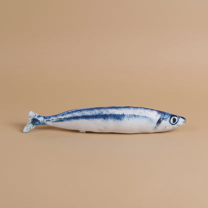 Model of a fish on a beige background