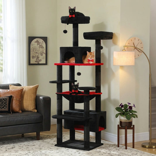 Black and red cat tree with cats inside, in a living room setting.