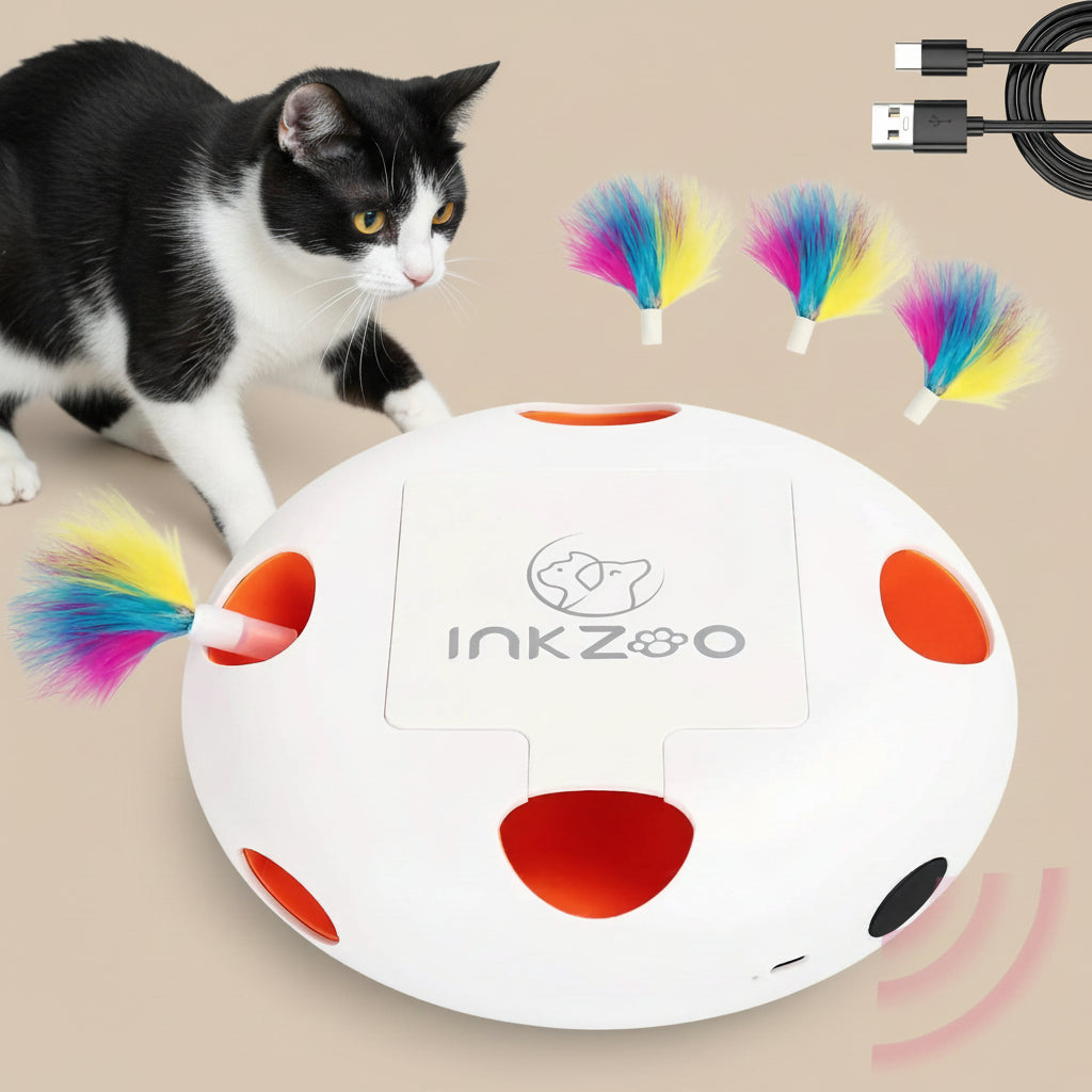 Cat playing with an Inkzoo interactive pet toy on a white background